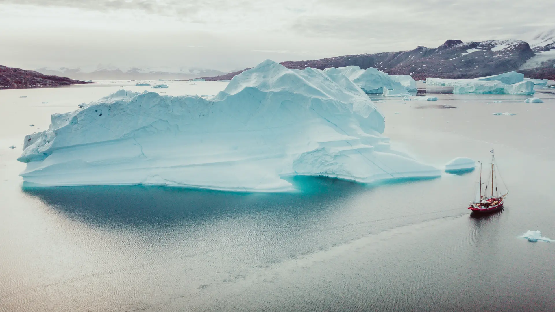 A large iceberg drifting in a calm Nordic sea